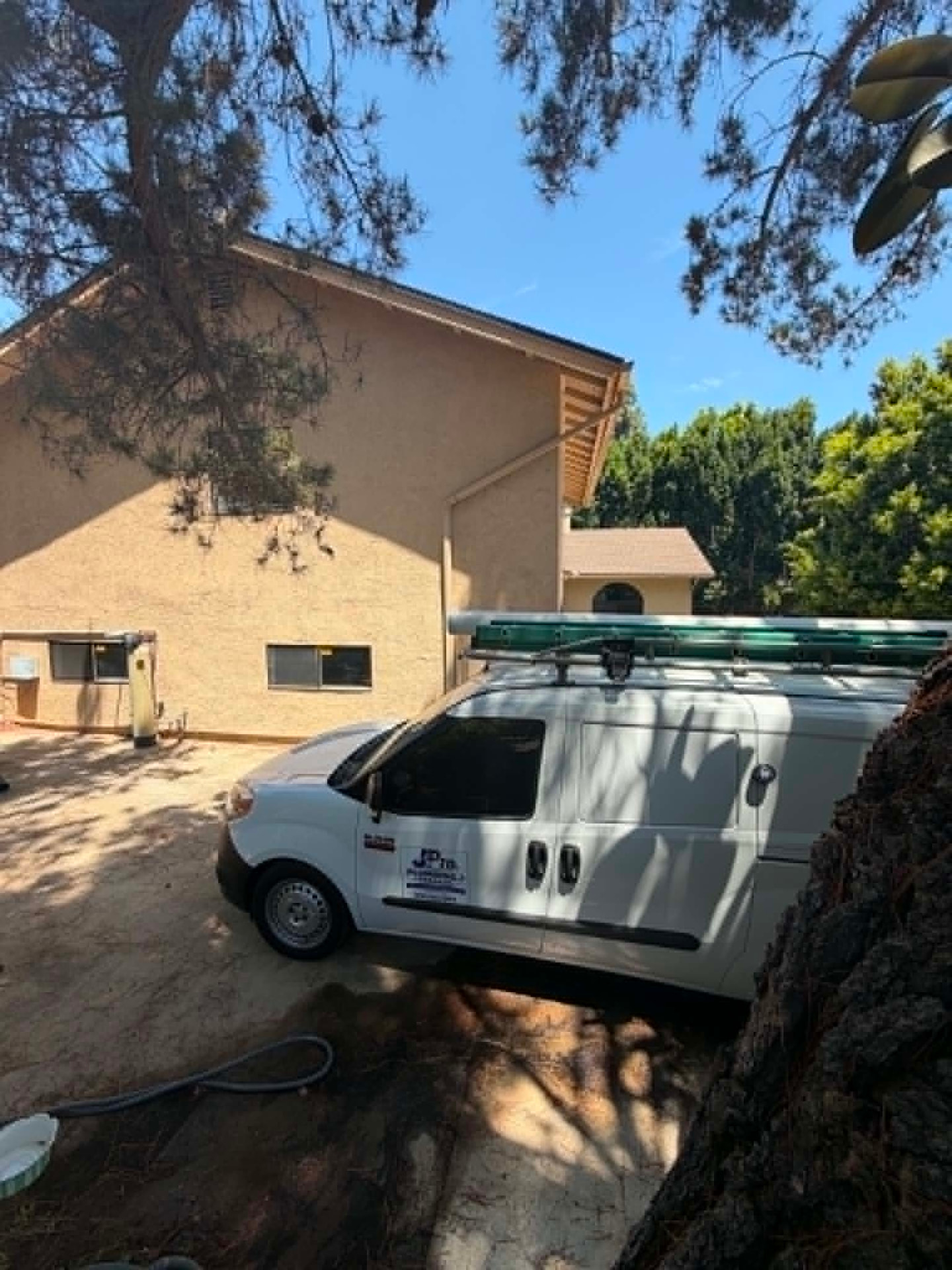 JPro4 Plumbing and Drain service van parked at a San Diego home on a job